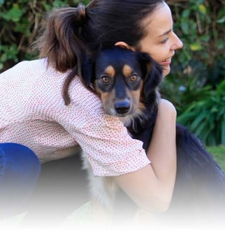Owner hugging dog