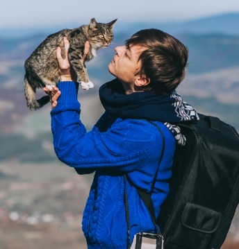 Dog outside next to pet parent